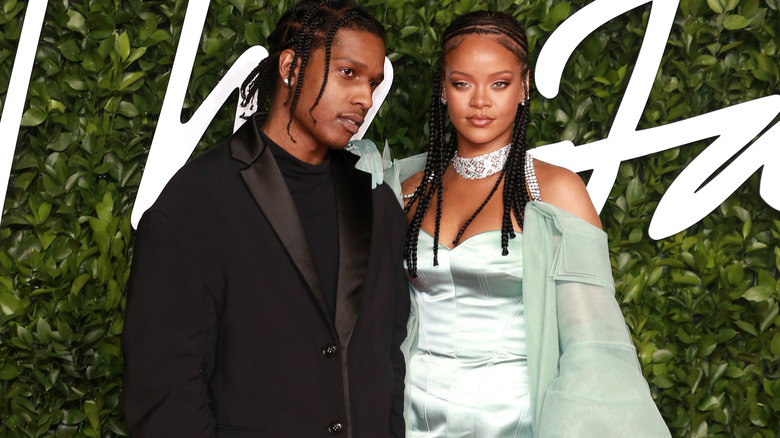 A$AP Rocky and Rihanna posing at event