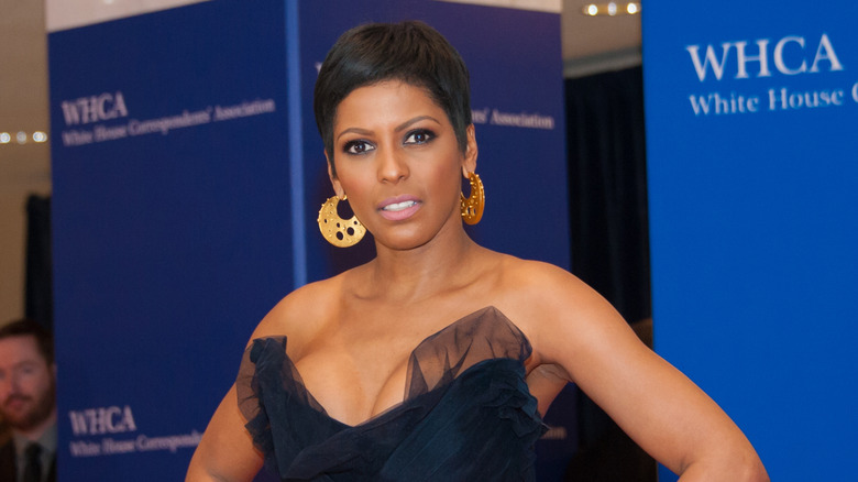 Tamron Hall poses in black formal dress