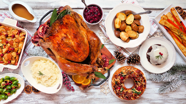 Turkey dinner with fruit cake and plum pudding