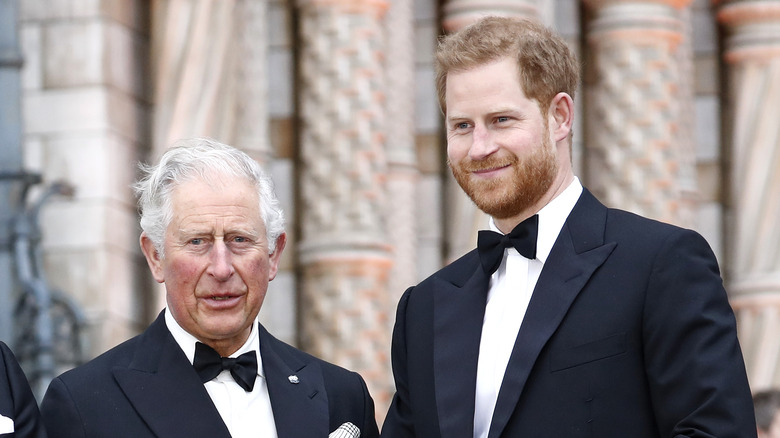 Prince Charles and Prince Harry dressed in tuxes.
