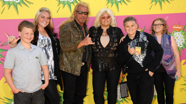 Dog the Bounty Hunter posing with his family at the 2013 Kids Choice Awards.