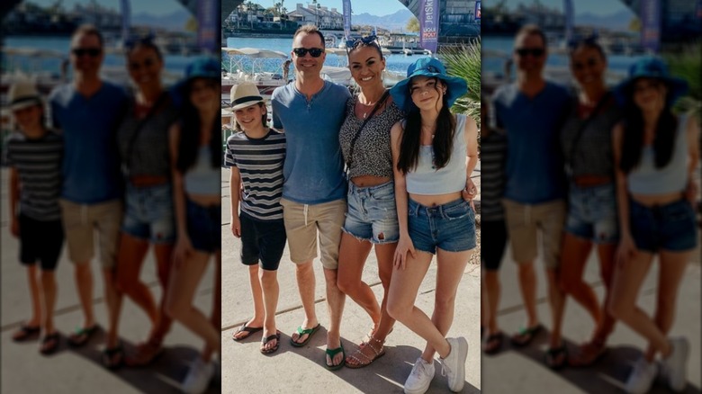 Wesley Chapman and his family posing for a photograph in the summer.