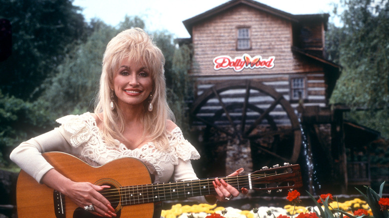 Dolly Parton playing guitar at Dollywood