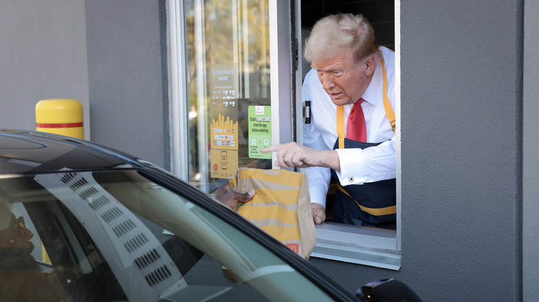 Donald Trump leaning out a McDonald's drive thru window