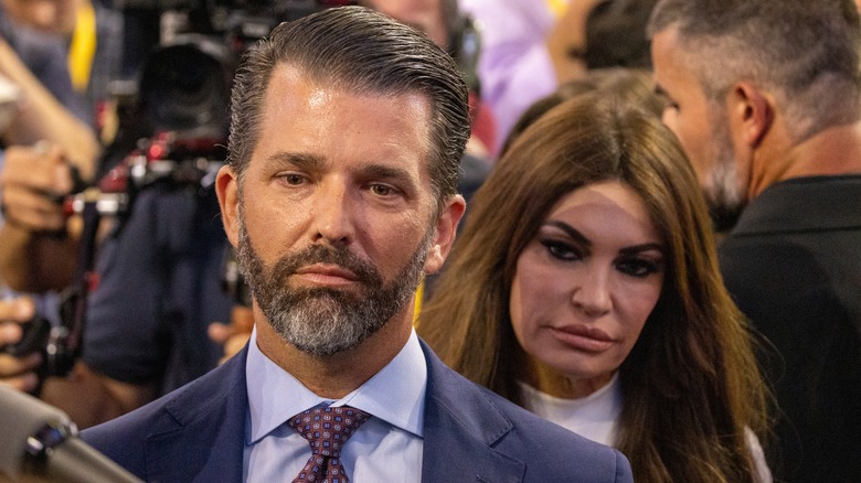 Kimberly Guilfoyle behind Donald Trump Jr.