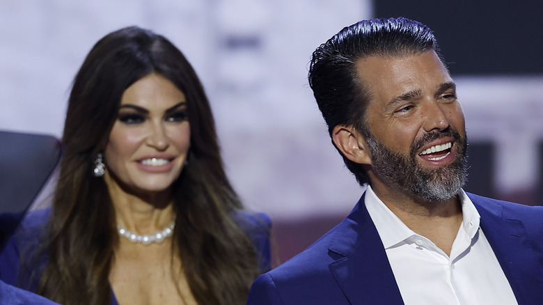 Kimberly Guilfoyle behind Donald Trump Jr.