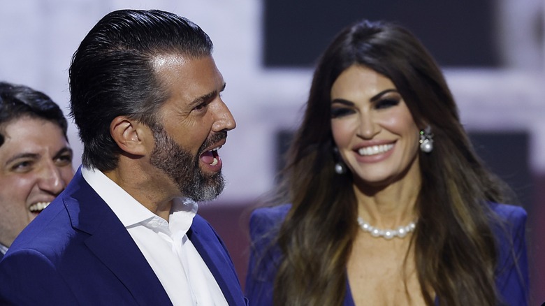 Donald Trump Jr. talking, Kimberly Guilfoyle smiling