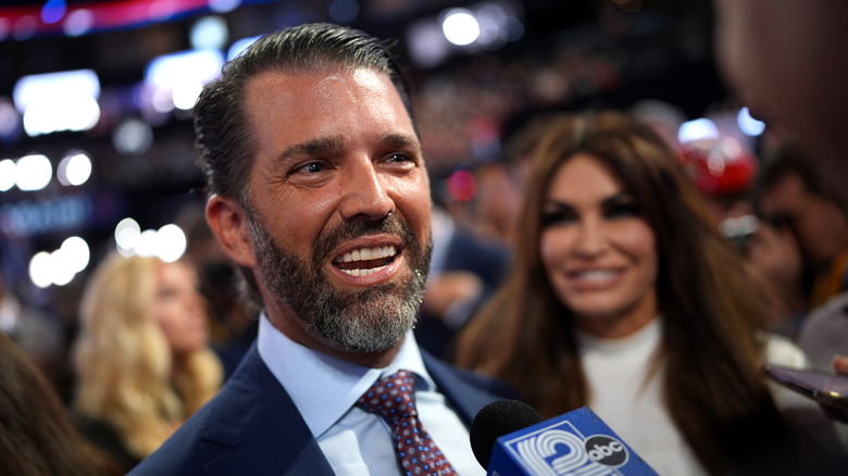 Donald Trump Jr with Kimberly Guilfoyle in the background