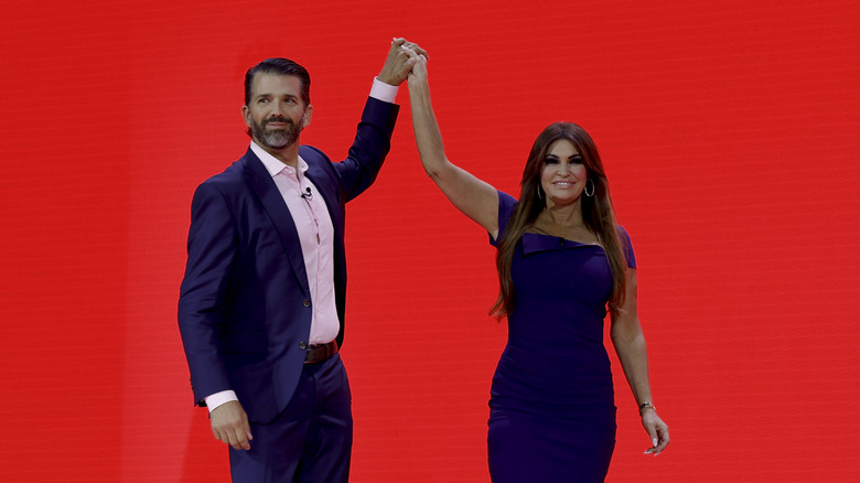 Donald Trump Jr. and Kimberly Guilfoyle holding hands