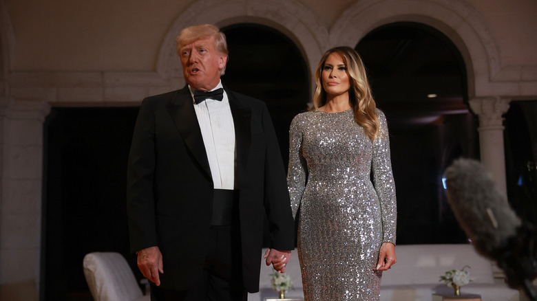 Melania Trump in silver gown with Donald Trump