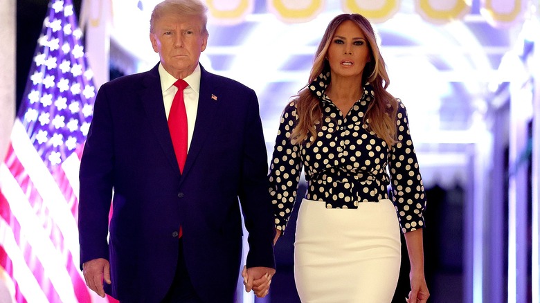 Donald and Melania Trump holding hands