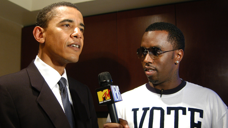 Diddy holding microphone to Barack Obama