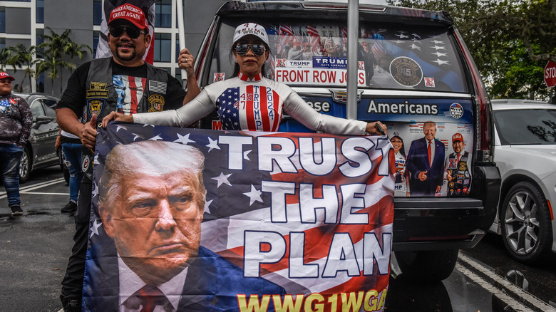 Trump supporters holding a flag