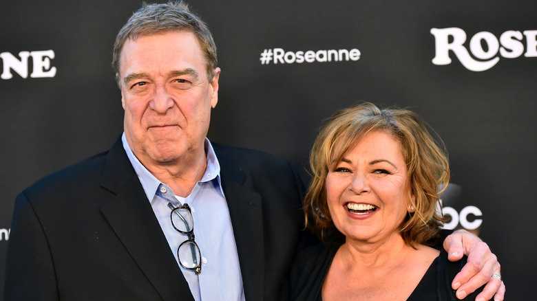 Roseanne Barr and John Goodman posing