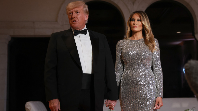 Donald Trump and Melania Trump holding hands