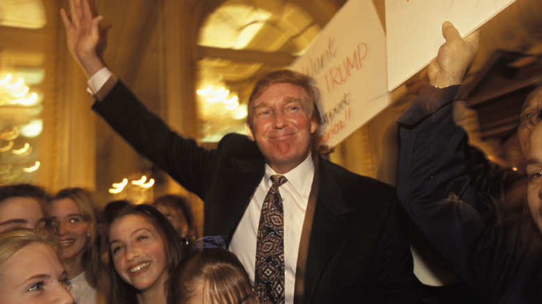 Donald Trump waving at supporters at the Plaza Hotel