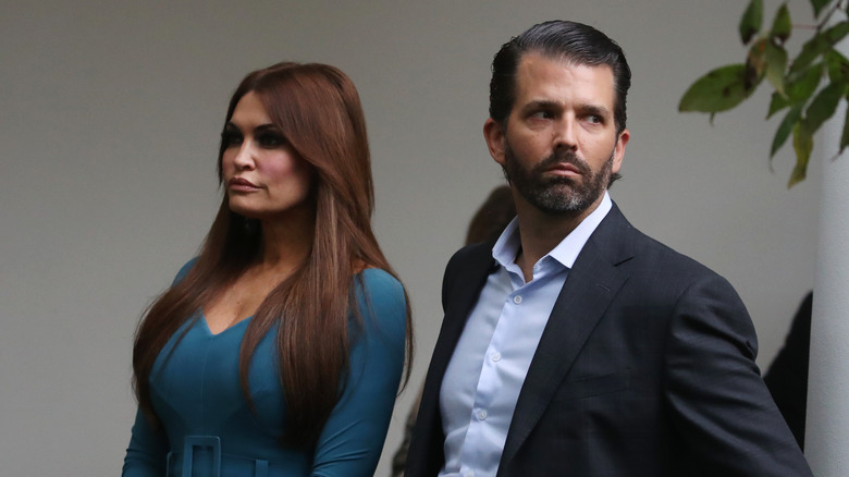 Kimberly Guilfoyle and Donald Trump Jr. looking away from each other