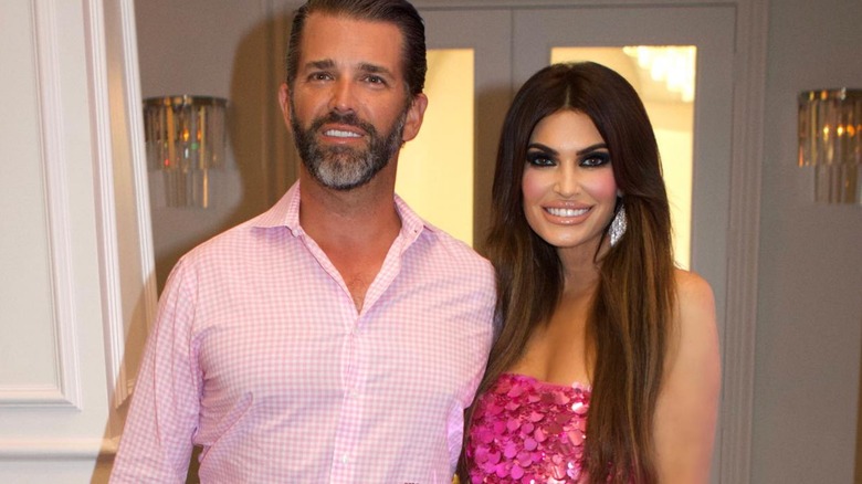 Donald Trump Jr. and Kimberly Guilfoyle smile side by side