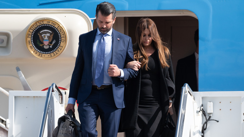 Donald Trump Jr. and Kimberly Guilfoyle disembarking Air Force One jet