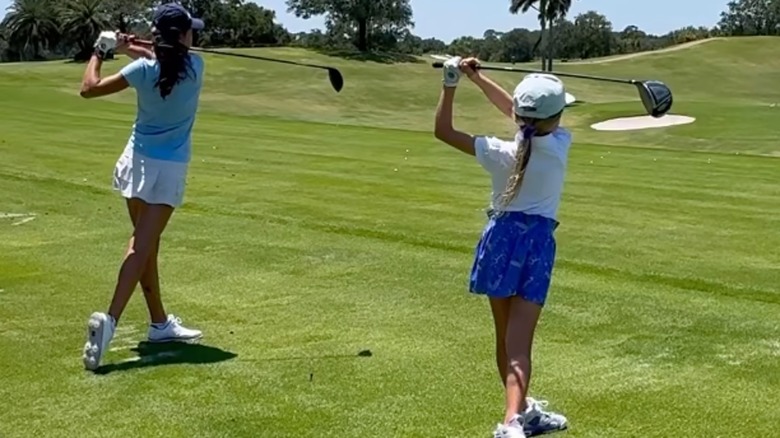 Chloe and Kai Trump golfing 