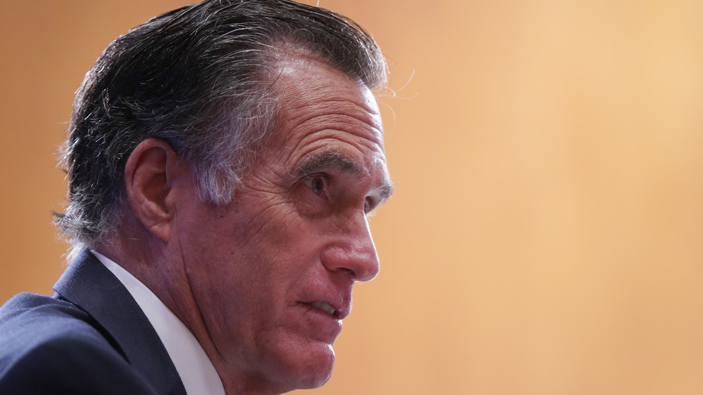 Senator Mitt Romney looking serious in profile