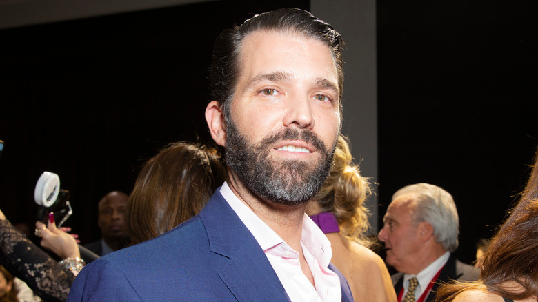 Donald Trump Jr. grinning at an event