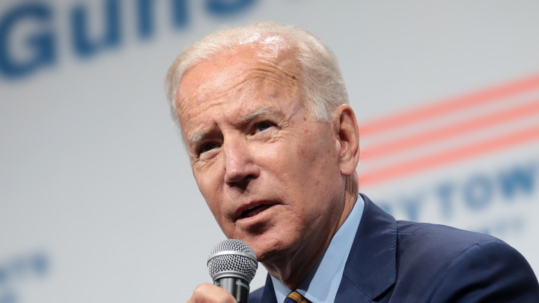 Joe Biden holding a microphone