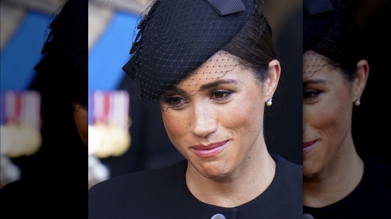 Meghan Markle smirking