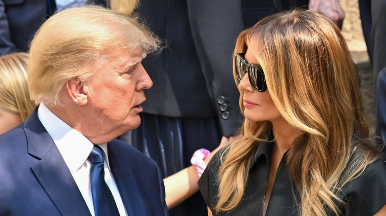 Donald Trump and Melania Trump looking at each other