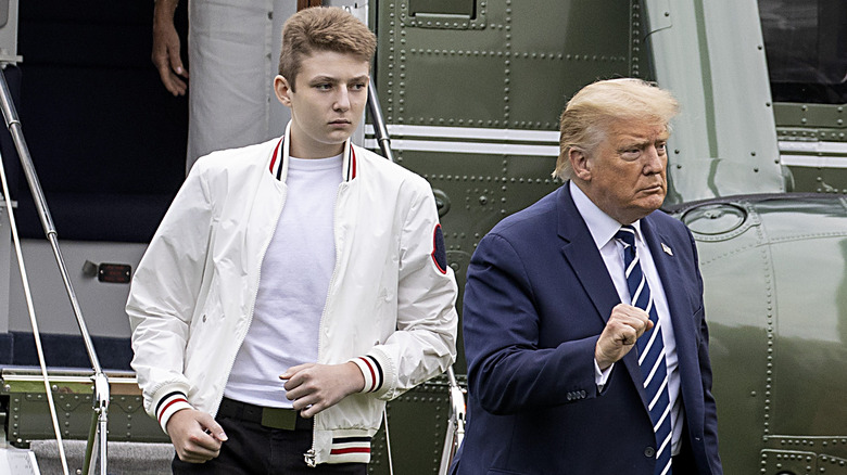 Barron and Donald Trump exiting airplane