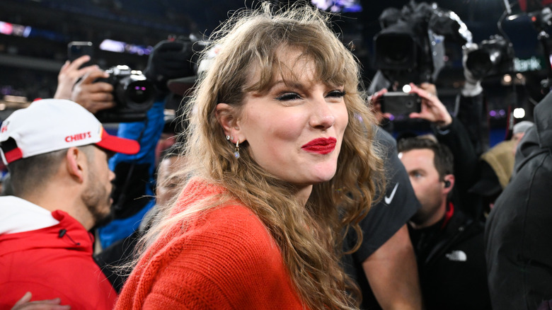 Taylor Swift on the field after a Chiefs win