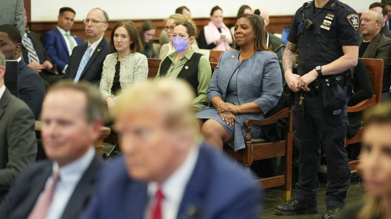 Donald Trump in court with New York Attorney General Letitia James sitting behind him