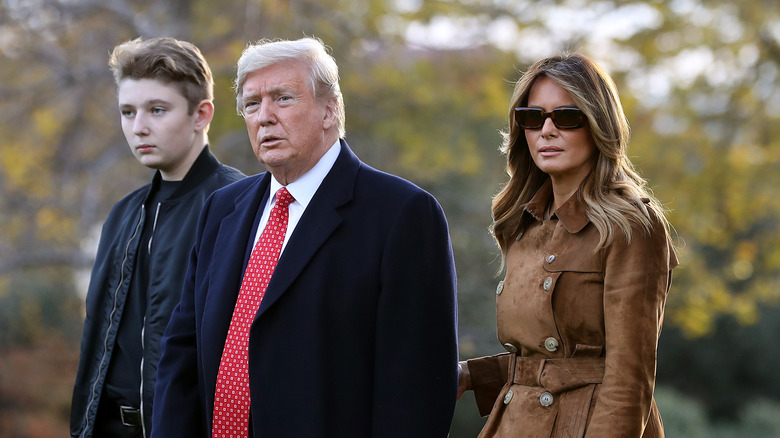 Barron, Donald, and Melania Trump walking