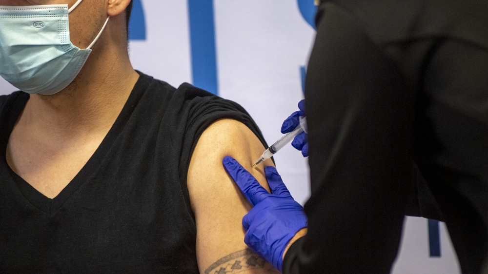 Healthcare worker administering a vaccine