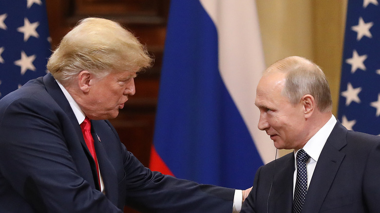 Donald Trump and Vladimir Putin shaking hands