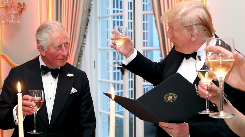 King Charles III and Donald Trump toasting