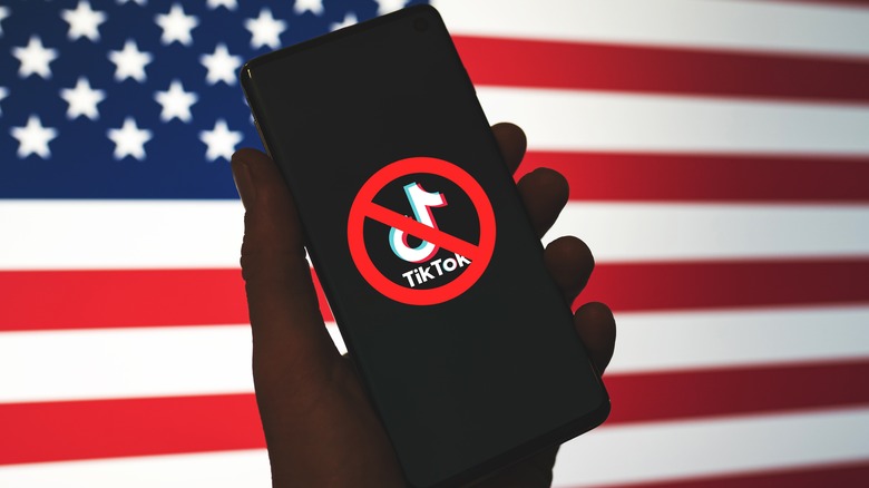 TikTok app with cancel symbol against American flag