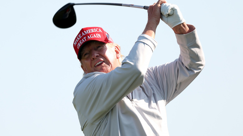 Donald Trump swinging golf club