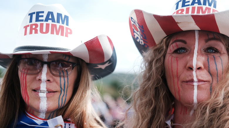 Two women wear Team Trump hats