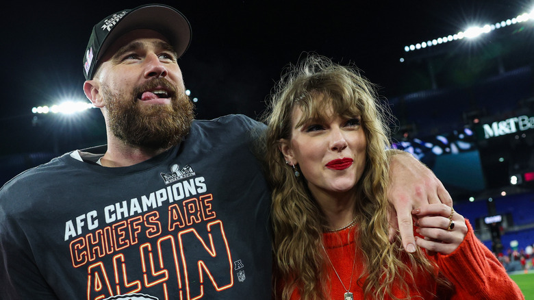 Travis Kelce and Taylor Swift smiling