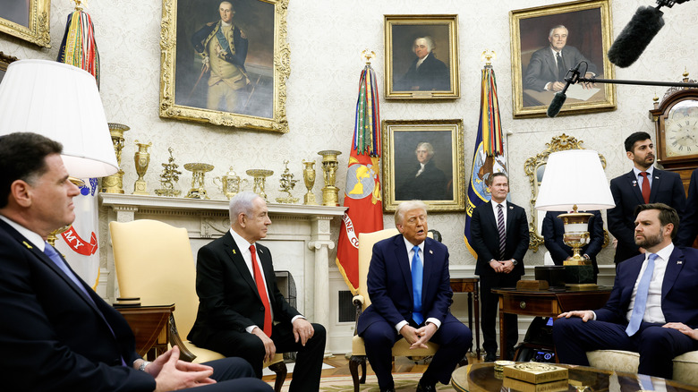 Donald Trump seated with Benjamin Netanyahu and JD Vance in the Oval Office