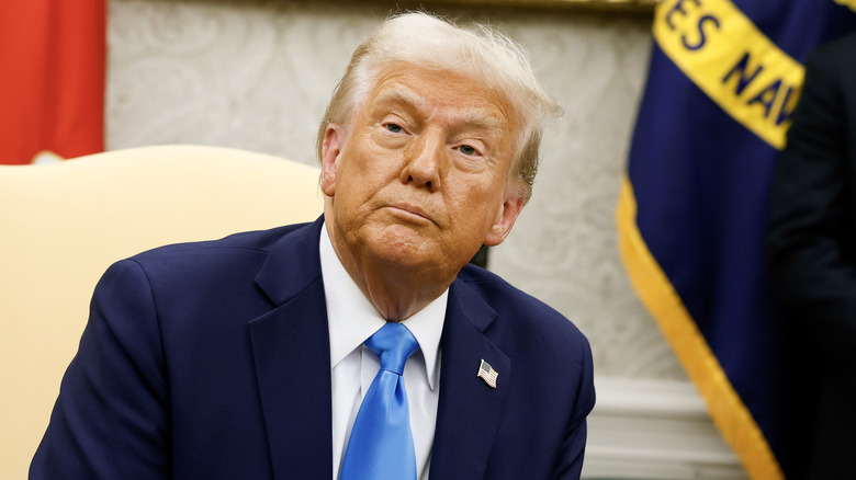 Donald Trump in the Oval office, listening while Benjamin Netanyahu speaks