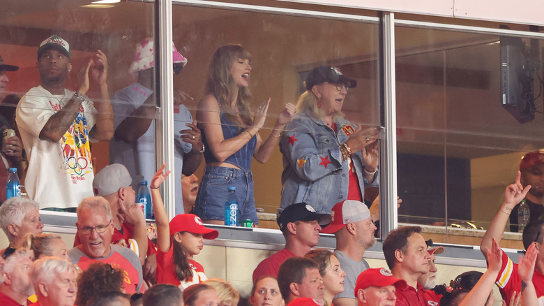 Taylor Swift and Donna Kelce cheering at a football game