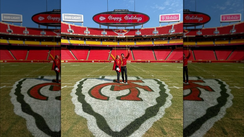 Hunter King and Tyler Hynes posing on the Kansas City Chiefs field 