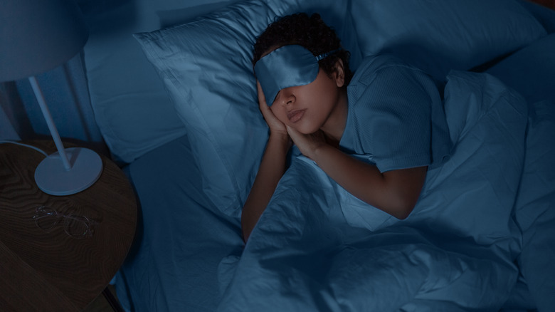 woman sleeping wearing sleep mask