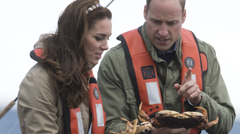 Prince William and Kate looking at crabs 