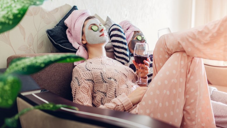 Woman relaxing while wearing face mask