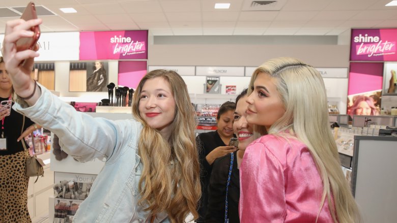 Kylie Jenner with fan at Ulta Beauty