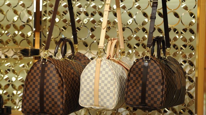 Three Louis Vuitton handbags