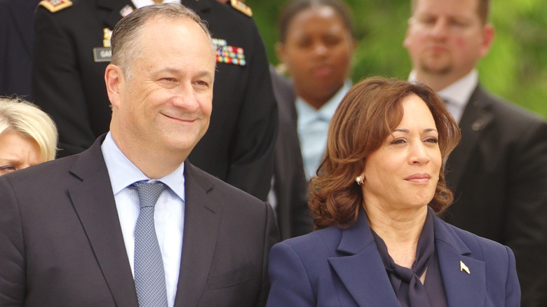 Doug Emhoff standing with Kamala Harris